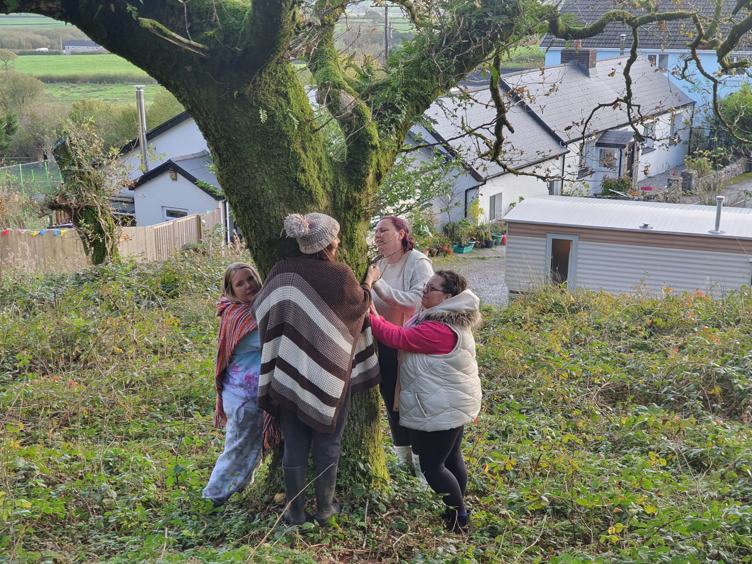 Women hugging a tree