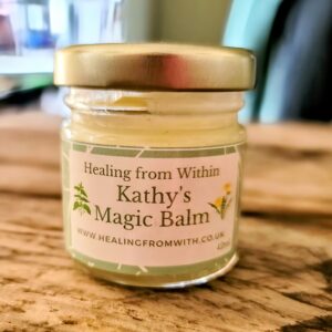 Kathy's Magic Balm in a glass jar, a handmade vegan-friendly multipurpose helbal skin balm