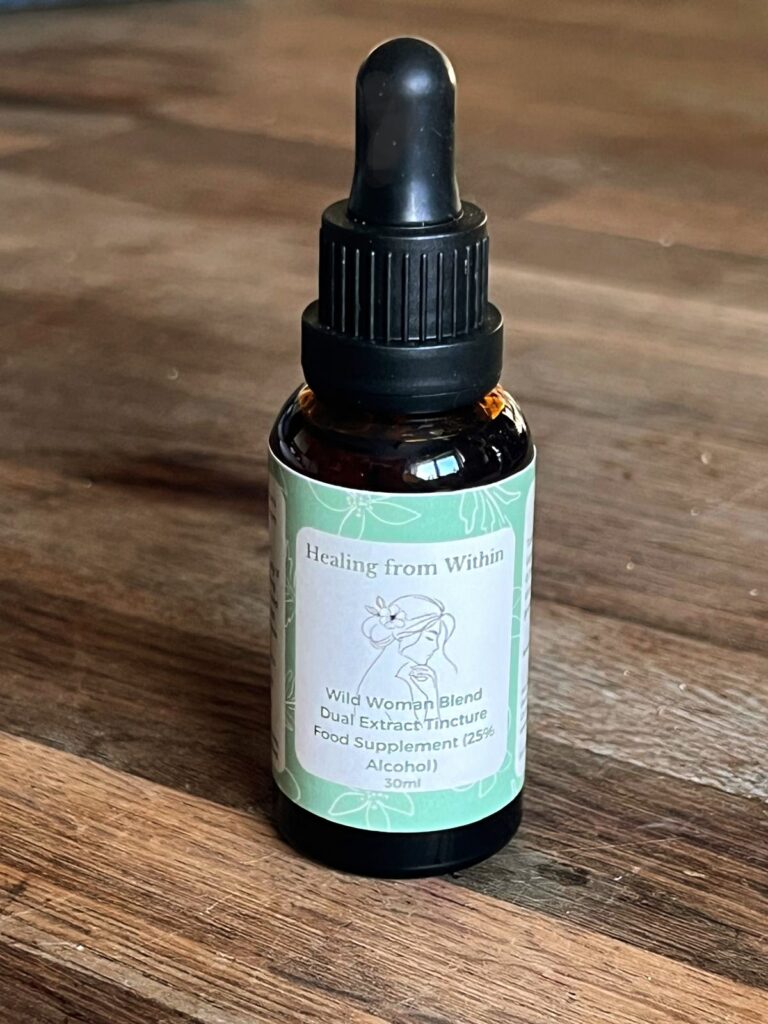 Wild ~Woman Bland mushroom tincture in an amber glass dropper bottle, handcrafted herbal remedy
