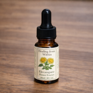 Amber glass dropper bottle of Elecampane flower essence with a cream label and botanical illustration, photographed on a wooden surface in natural light.