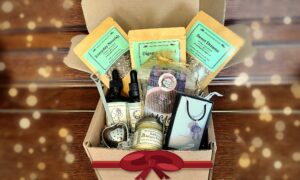 Healing From Within Christmas hamper with mushroom tinctures, three herbal teas, Kathy's Magic Balm, a heart tea strainer, crystal mushroom necklace and cacao